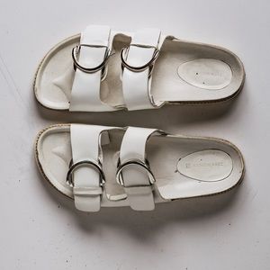 Two straps, with an individually buckle detail.